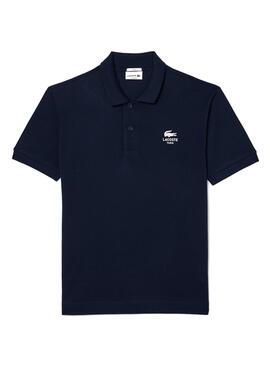 Polo Lacoste L.12.12 mit marineblauem Logo-Druck für Herren und Damen.