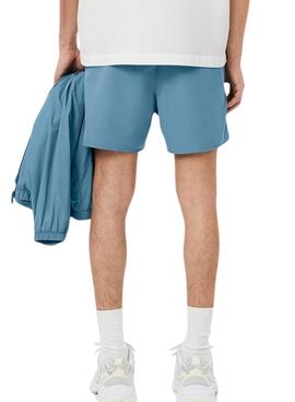 Schnelltrocknende blaue Lacoste-Badehose für Herren